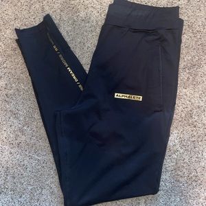 Men’s Alphalete Joggers. Black with gold. Size Medium.